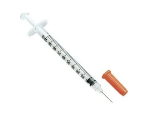 Disposable medical syringe with needle and orange cap for home healthcare