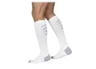 White compression socks for legs, featuring gray heel and toe, shown on person standing