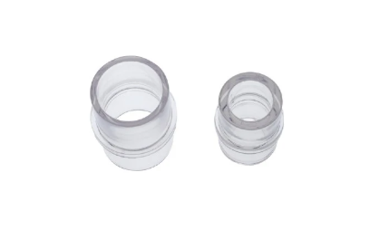 Two clear plastic medical tube adapters on a white background