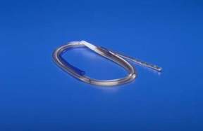 Medical urinary catheter tube on blue background, essential home healthcare supply