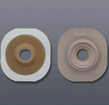 Two ostomy barriers for stoma care on a gray background
