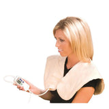 Woman using digital moist heat pad on shoulders and neck for pain relief