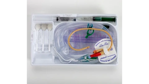 Medical catheter kit with tubing, syringe, and securement device in plastic tray