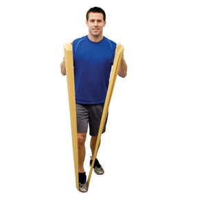 Man exercising with yellow latex-free resistance band for physical therapy