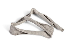 Sterile wound packing strip dressing on white background, medical gauze for wound care.