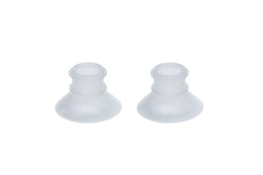Pair of transparent silicone breast pump flanges on white background