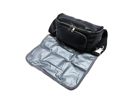 Black medical supply waist bag with front zipper pockets and fold-out insulated mat