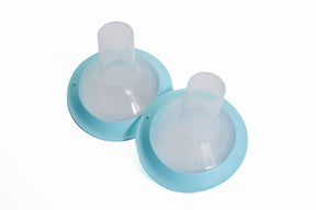 Two silicone breast pump flanges with blue rims on a white background