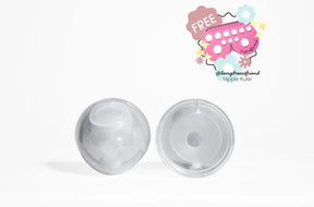Two clear breast pump flange inserts on white background with free nipple ruler graphic.