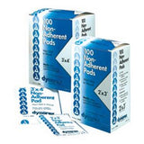 Non-adherent sterile pads for wound care, two boxes with product details visible