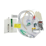 Medical catheterization kit with catheter, syringes, gloves, tubing, and accessories on white background