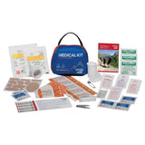 Outdoor adventure medical kit with bandages, gauze, first aid supplies, and instruction manual