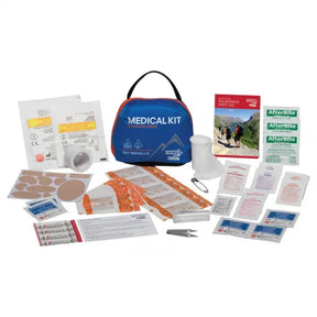 Outdoor adventure medical kit with bandages, gauze, first aid supplies, and instruction manual