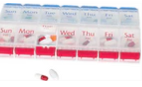Weekly pill organizer with compartments labeled for each day, holding assorted pills