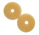 two round hydrocolloid barrier rings for ostomy care on white background