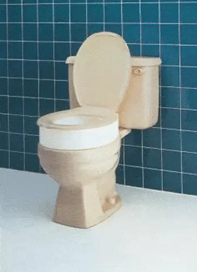 Raised toilet seat elevator for bathroom accessibility on standard toilet
