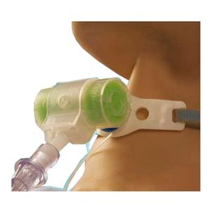 Close-up of a tracheostomy tube holder with green foam padding on a person's neck