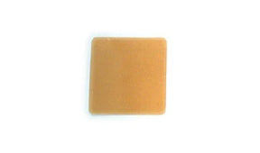 Square skin barrier wafer for ostomy care shown on a white background.