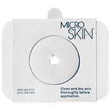 Microskin adhesive barrier ring with center hole for medical device attachment