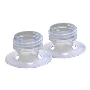 Pair of transparent silicone medical adaptors with circular base on white background