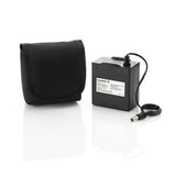 Medical device battery pack with attached cable and black carrying pouch on white background