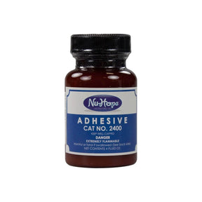 Nu-Hope adhesive bottle for medical use with blue label, cat no. 2400, 4 fl oz