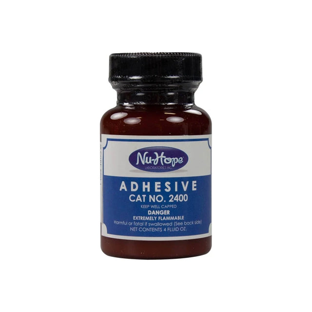 Nu-Hope adhesive bottle for medical use with blue label, cat no. 2400, 4 fl oz