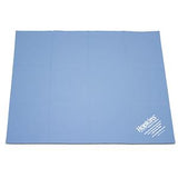 Blue medical supply underpad with white Hopkins label on corner, used for patient care