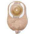 Beige ostomy pouch with circular adhesive barrier and drainable spout, medical supply