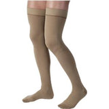 Beige compression stockings for leg support and circulation, thigh-high medical hosiery
