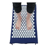 Person standing on acupressure mat for foot therapy and pain relief