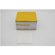 Box of sterile medical gauze pads with one gauze pad displayed in front on white background
