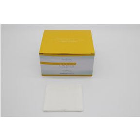 Box of sterile medical gauze pads with one gauze pad displayed in front on white background
