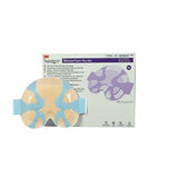 Silicone foam border dressing with adhesive wings in front of product packaging