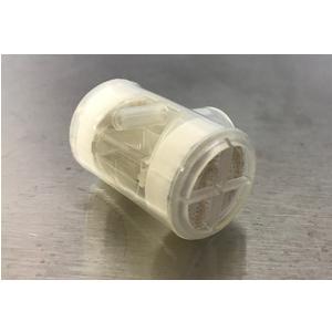 Transparent medical filter cartridge on a stainless steel surface