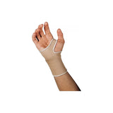 Hand wearing a beige wrist support brace for compression and joint pain relief