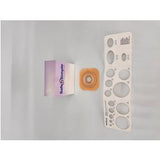 Ostomy barrier ring, stoma measuring guide, and product box on light background