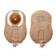 Two beige ostomy bags with round adhesive flanges and drainage outlets, medical supplies.