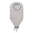 Closed gray ostomy bag with circular flange and drainable spout, medical supply product
