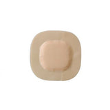 Square beige adhesive wound dressing with central absorbent pad, medical supply