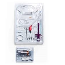 Sterile medical procedure kit with syringe, tubing, scissors, and clamps in clear tray