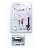 Sterile medical procedure kit with syringe, tubing, scissors, and clamps in clear tray