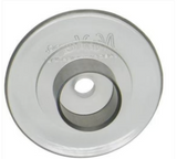 Close-up of a round medical supply part with central hole, metallic finish