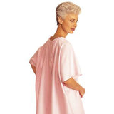 Senior woman wearing a light pink medical gown, hospital patient clothing