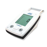 Digital blood pressure monitor with large display screen and control buttons on white background