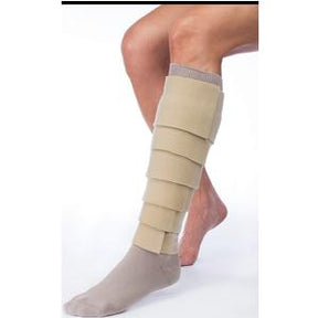 Adjustable beige compression wrap on lower leg for edema or lymphedema management