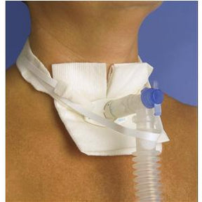 Tracheostomy tube and neck strap secured on person's neck for respiratory support