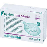 Box of 3M Tegaderm Foam Adhesive medical wound dressing with product details visible.