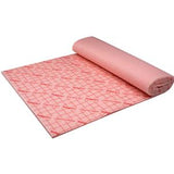 Rolled pink medical underpad sheet on white background, disposable absorbent pad