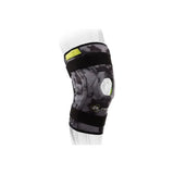 Adjustable black knee brace with open patella on mesh mannequin leg for joint support